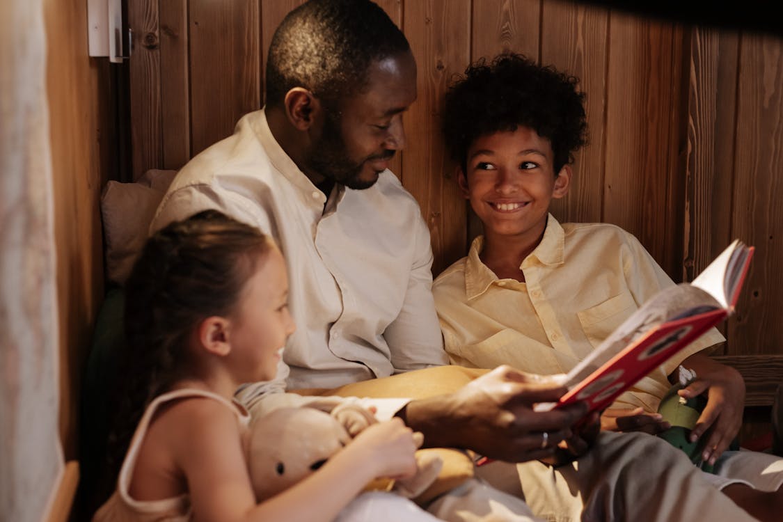 Father reading to his children