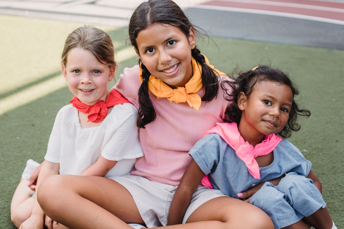 Children walking outside together with backpacks after saying goodbye to nursery