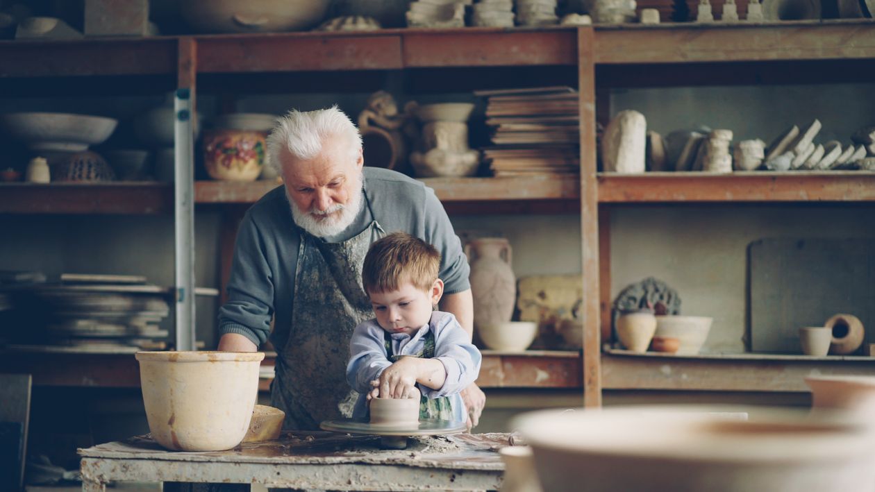 A craftsperson working by hand on a creative piece, symbolising a human illustrator