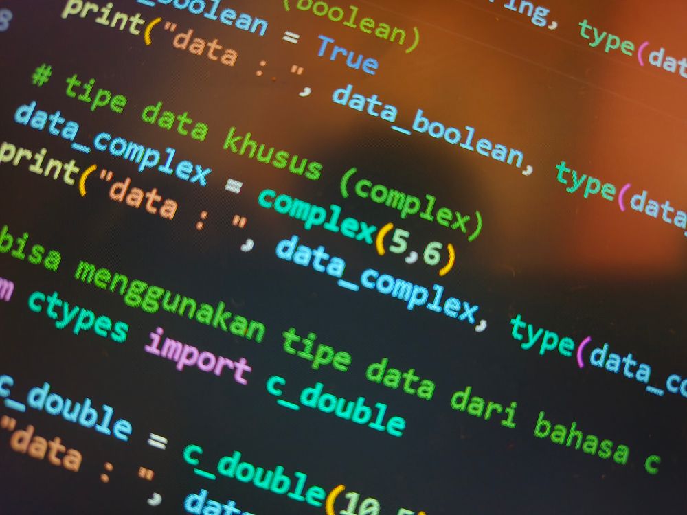 Colourful code on a computer screen, symbolising the technical layer behind an AI story