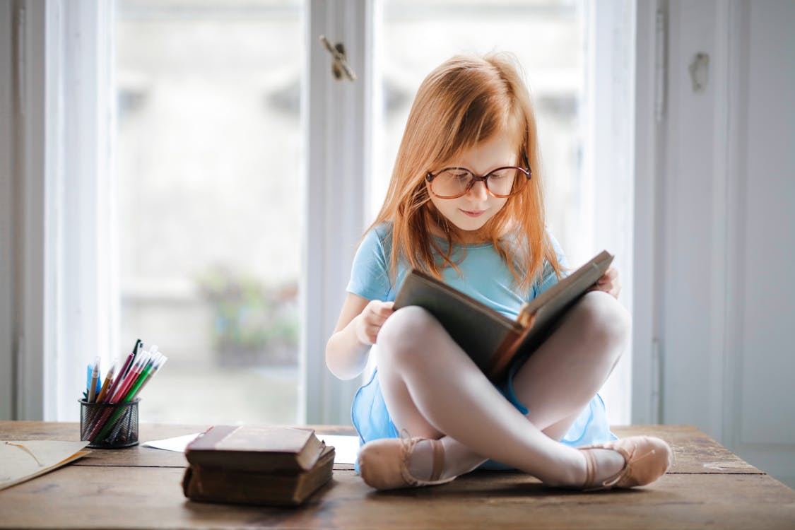 Girl reading a book with concentration