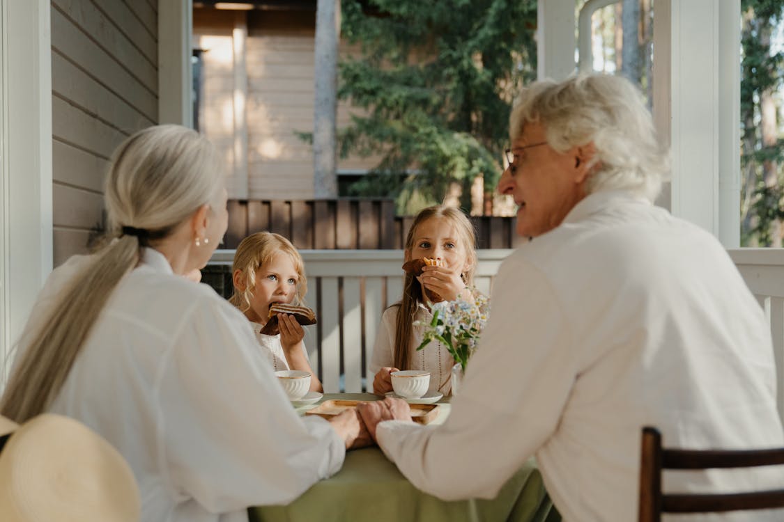 Grandparents sitting together with their grandchildren