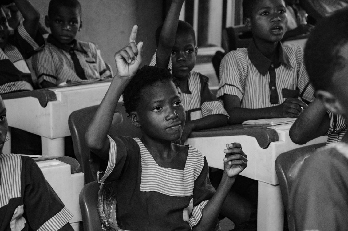 Schoolchildren in uniform in a bright classroom