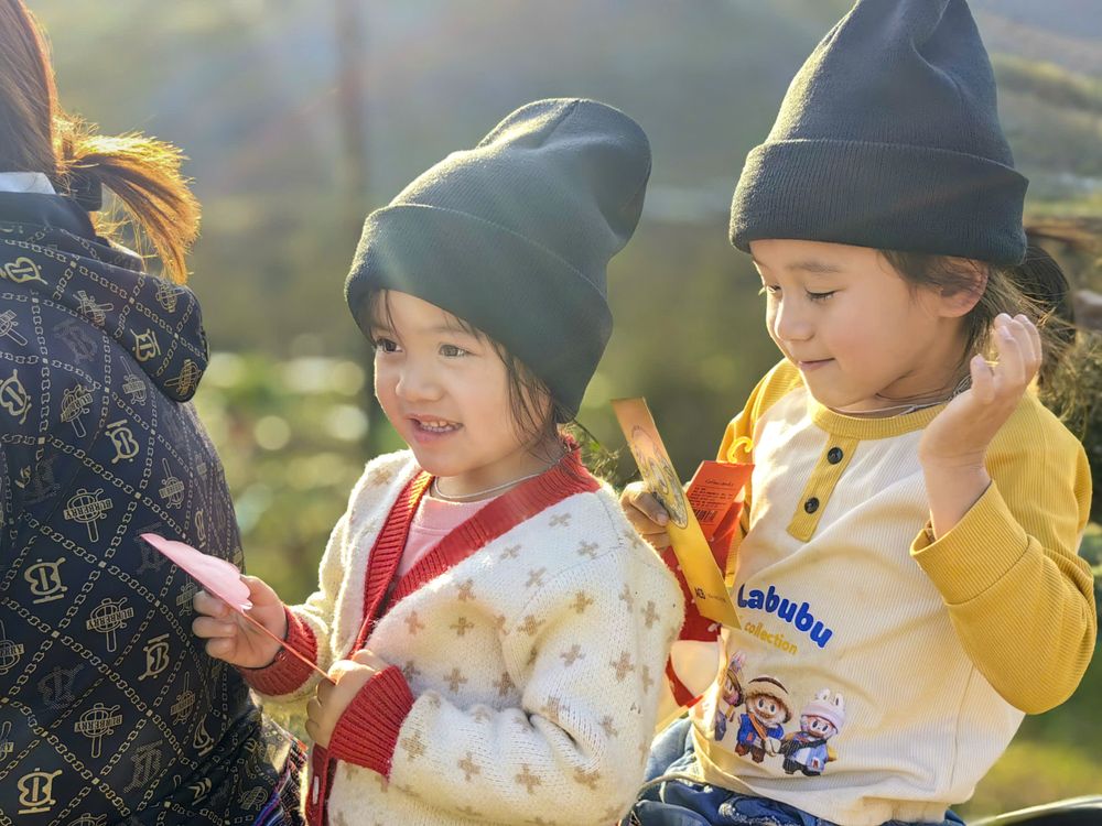 Two children outdoors on a sunny day