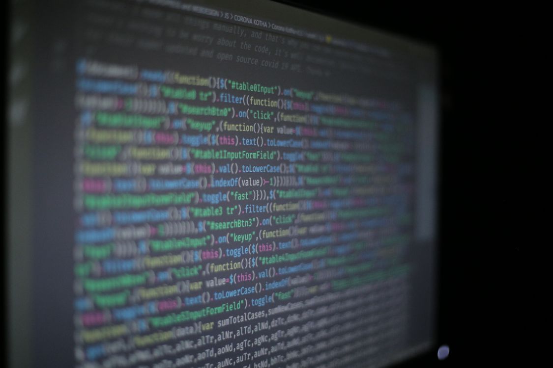 Programming code on a laptop, symbolising fine-tuning a style model