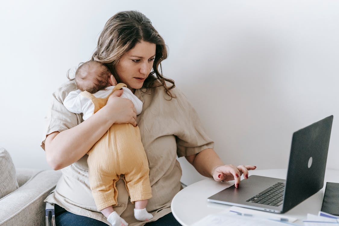 A working mother with her baby — care and exhaustion often go hand in hand