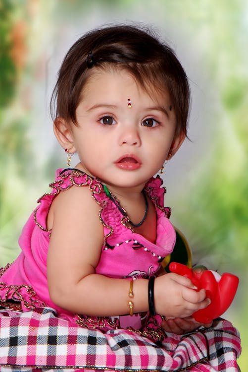 Indian baby girl in vibrant traditional dress