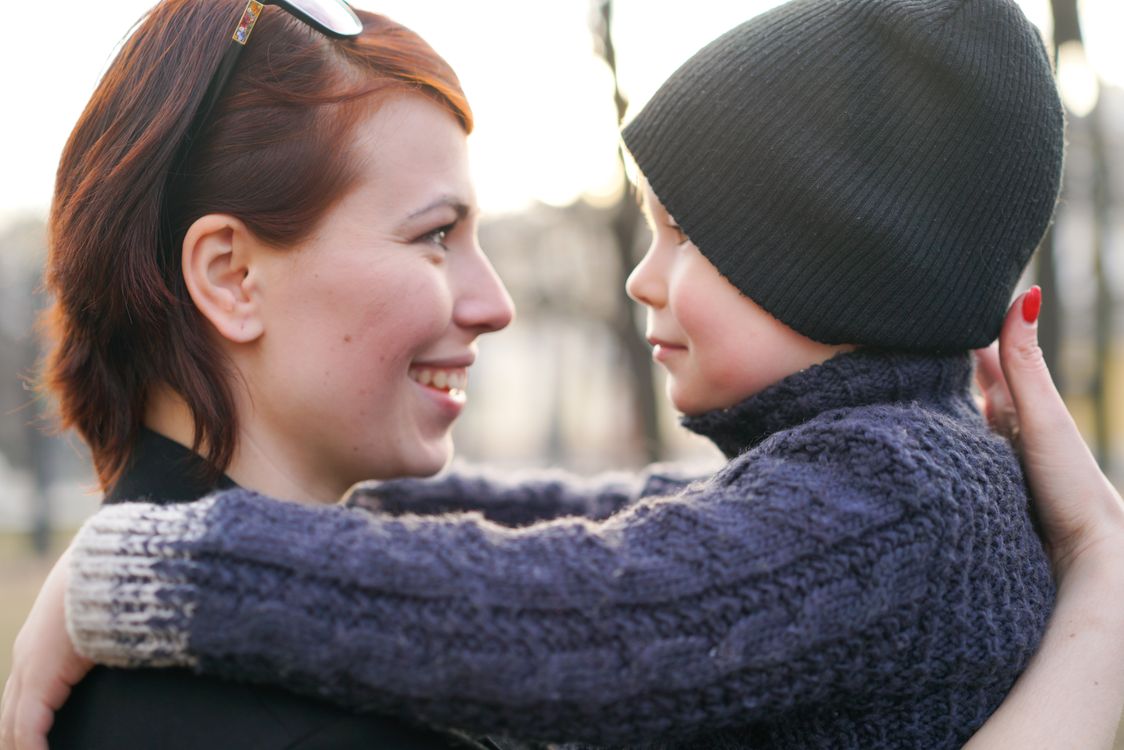 A parent reading aloud to a young child