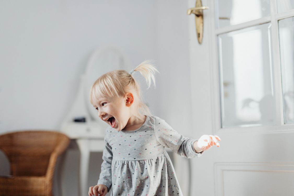 A toddler laughing - exactly the age when the vocabulary spurt typically takes hold